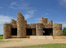 Artist Turned Abandoned Shop Into Attractive Building With Wooden Jacket